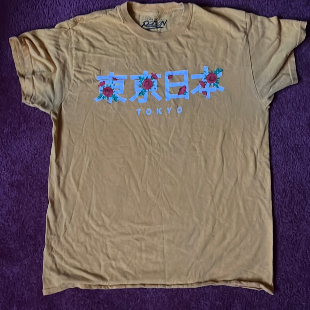 A yellow tee shirt short sleeve, size medium